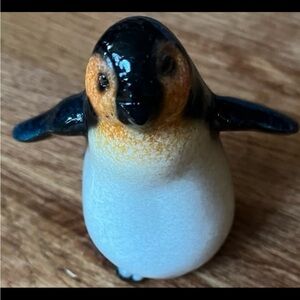 Bungalow road glazed happy penguin figurine.